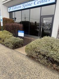 Building exterior with sign reading Edison Spine Center